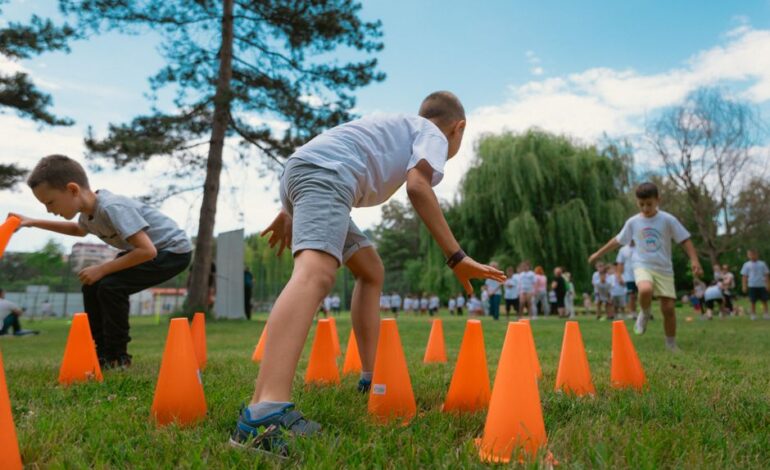Group of kids enjoying exercise and play at a park obstacle course.