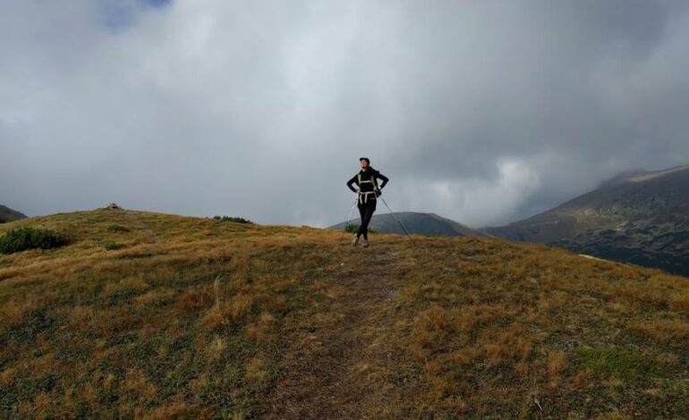 Hiker on a foggy mountain trail in the scenic Tatras near Banská Bystrica, Slovakia.