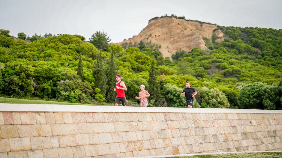 Three people jogging along a pathway in Gelibolu National Park, Türkiye.