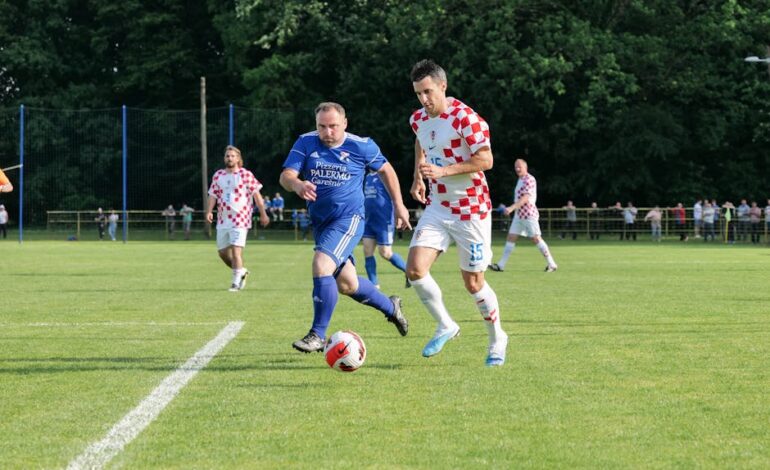 Players in action during a soccer match in Garešnica, showcasing teamwork and competition.