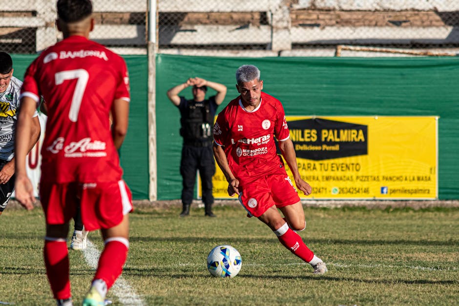 A dynamic scene of an amateur soccer match featuring players in action on the field.