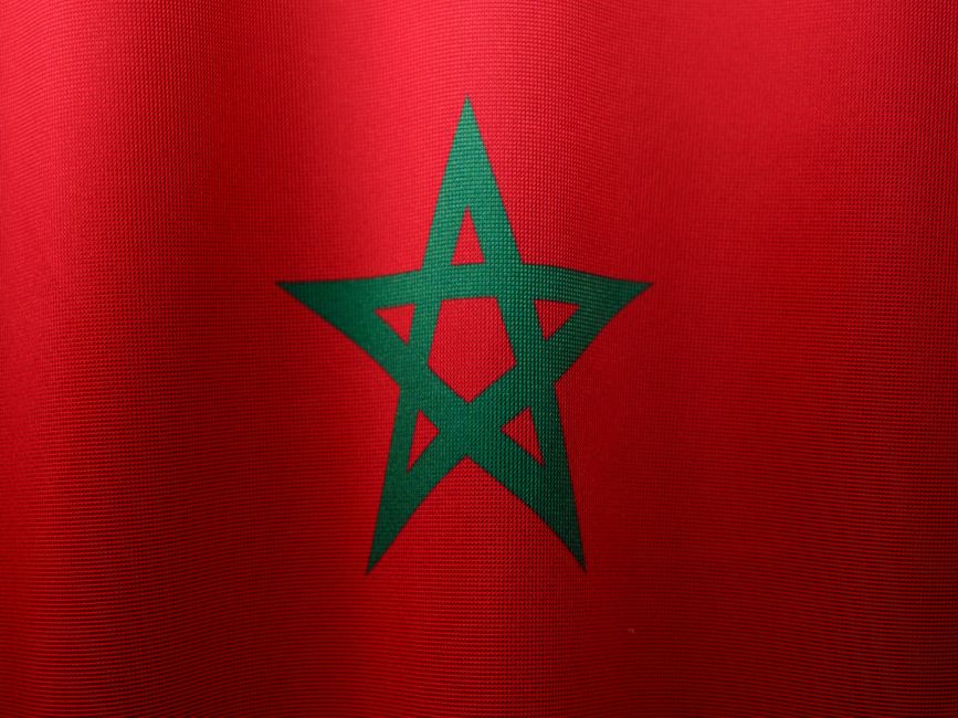 Detailed close-up of the Moroccan flag, highlighting its vibrant colors and iconic green star.