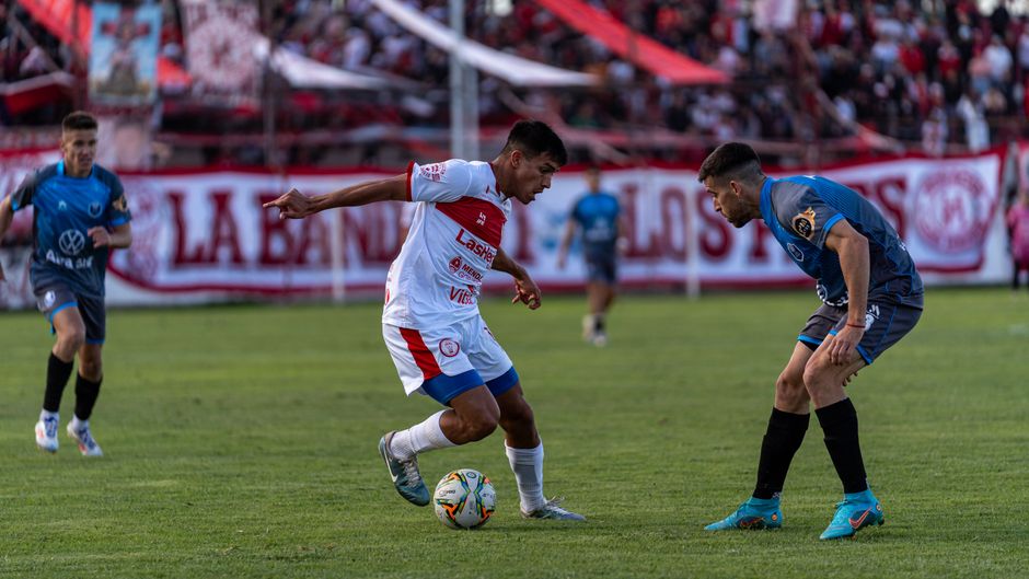 Exciting soccer match with players in action, showcasing skill and competition on the field.