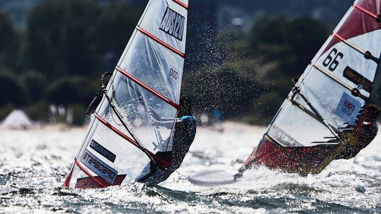Exciting windsurfing competition in Sopot, Poland with athletes in motion on the sea.