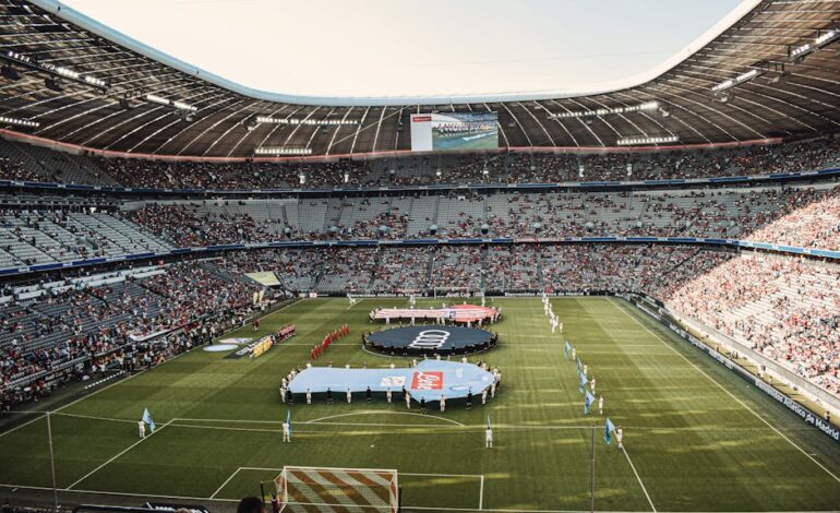 Captivating view of a soccer match at Munich's iconic Allianz Arena, filled with excited fans.